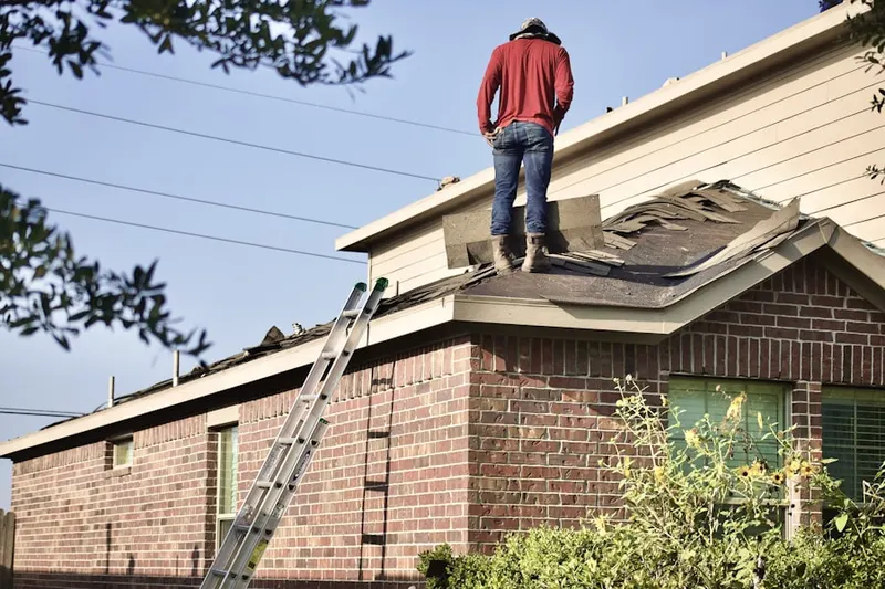 Professional roofer working on a residential roof in Dayton